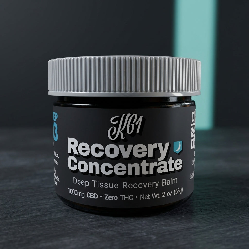 K61 Recovery Concentrate balm jar on charcoal with a teal light band behind