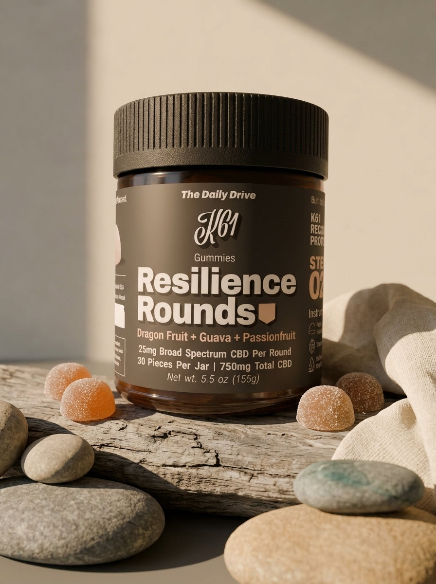 K61 Resilience Rounds gummies jar on river stones with linen