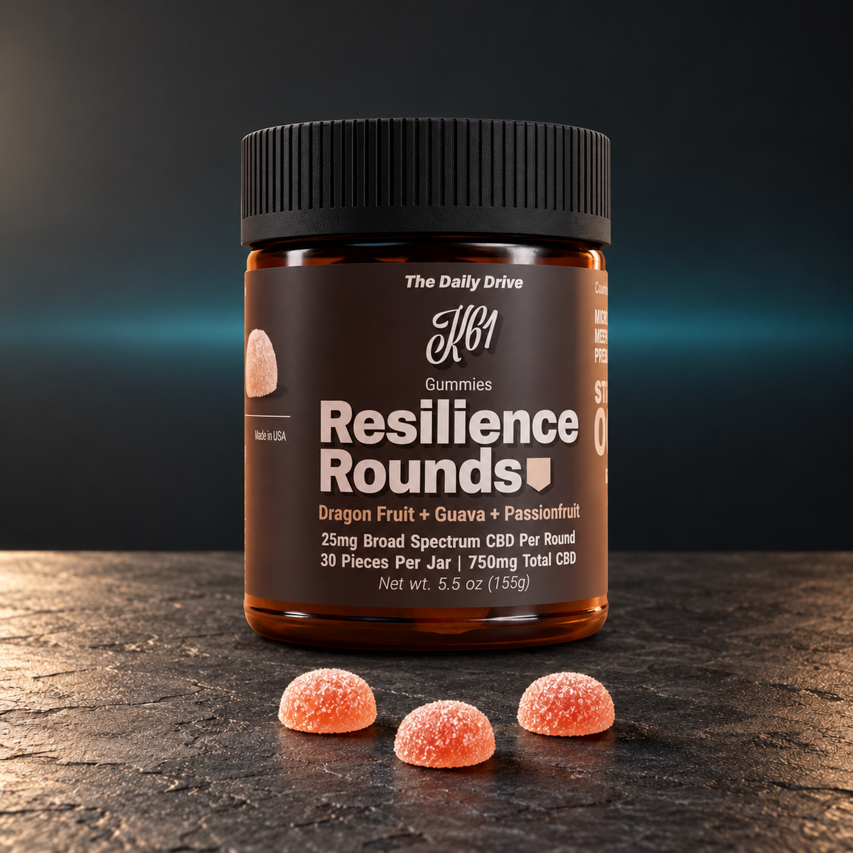 K61 Resilience Rounds gummies jar on dark charcoal slate with a soft teal glow behind and three gummies in front